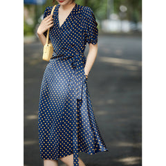 Schwarzes und Blumendruckseidenkleid mit Puffärmelen